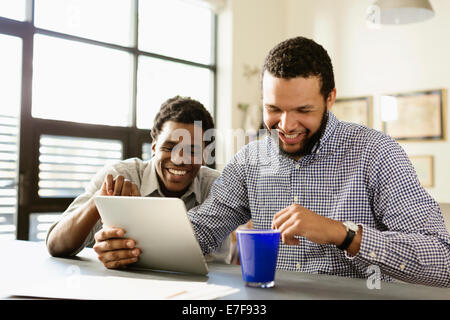 Businessmen working together in office Stock Photo