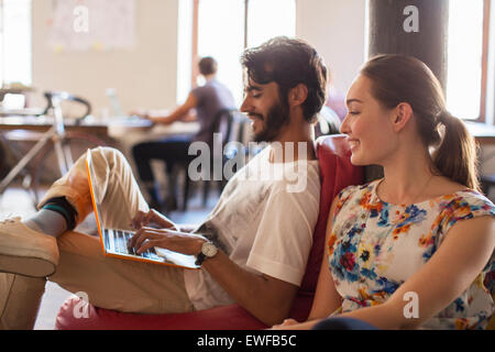 Casual business people using laptop in office Stock Photo