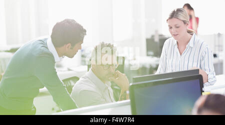 Business people working at computer in office Stock Photo