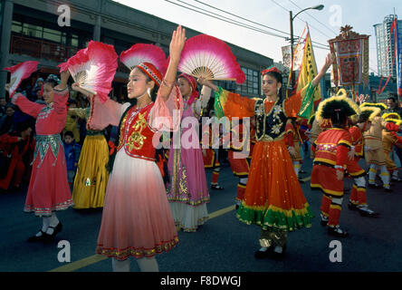 Chinese New Year Parade Festival Celebration, Dancers dancing with Fans - Chinatown, Vancouver, BC, British Columbia, Canada Stock Photo