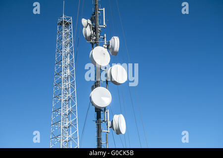 Cell phone antenna or aerial tower used for GSM an Stock Photo