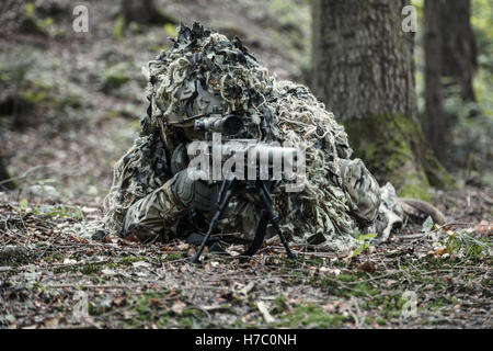 sniper wearing ghillie suit Stock Photo