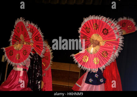 Group of children performing a Chinese traditional dance at U.S. school show Stock Photo