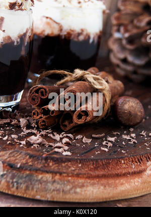 cinnamon with chocolate and nuts, selective focus Stock Photo