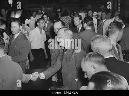 President Harry S. Truman shakes hands during a visit to Kansas City shortly after taking the oath of office in 1945. Stock Photo