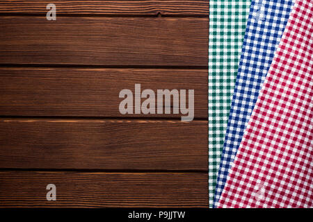 Napkin in a red, green, blue and white cage on a wooden backgrou Stock Photo