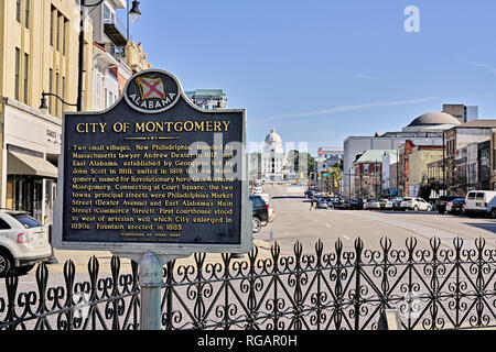 Historical marker describing the City of Montgomery Alabama founding with Dexter Avenue and the state capitol in the background in Montgomery AL, USA. Stock Photo