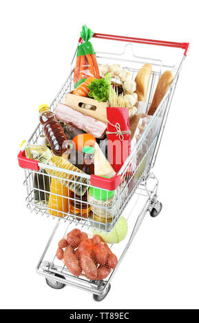 Shopping cart full with various groceries isolated on white Stock Photo