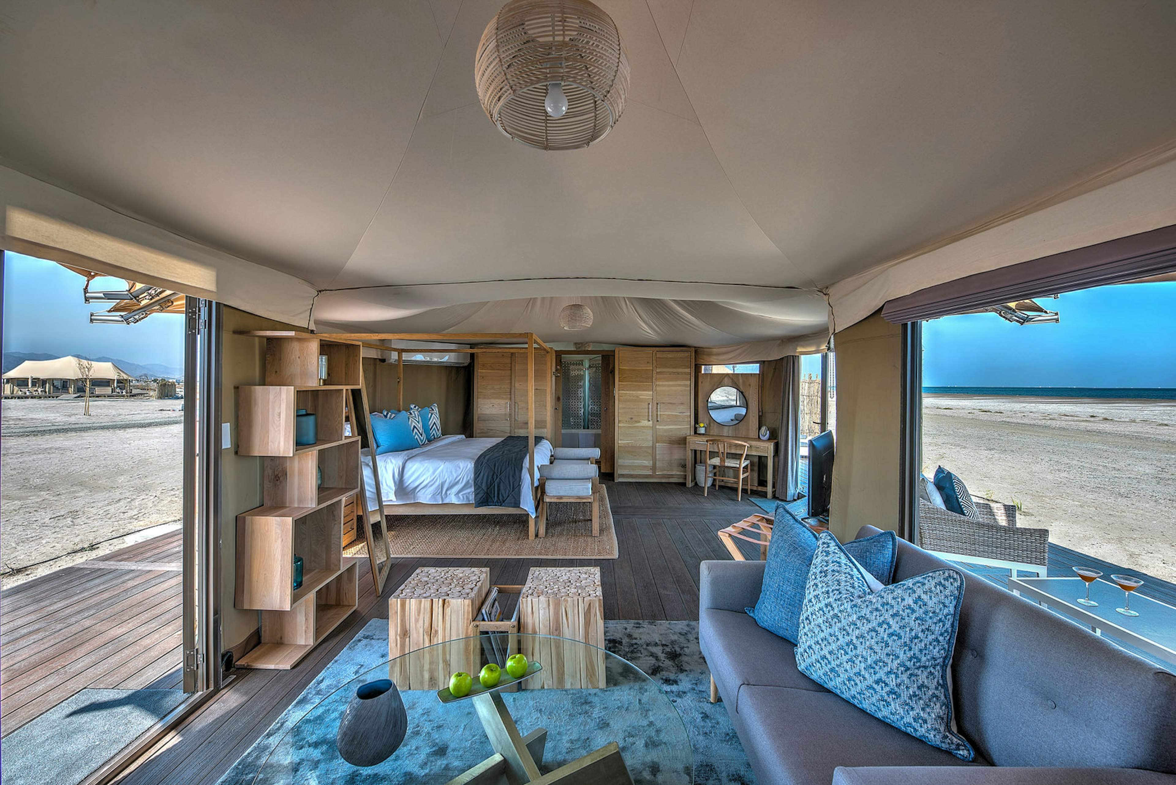 Interior of a safari tent at Kingfisher Lodge, with views of the beach of Sharjah, United Arab Emirates