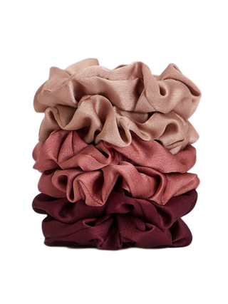 Kitsch Holiday Satin Scrunchies stacked up on top of one another on white background