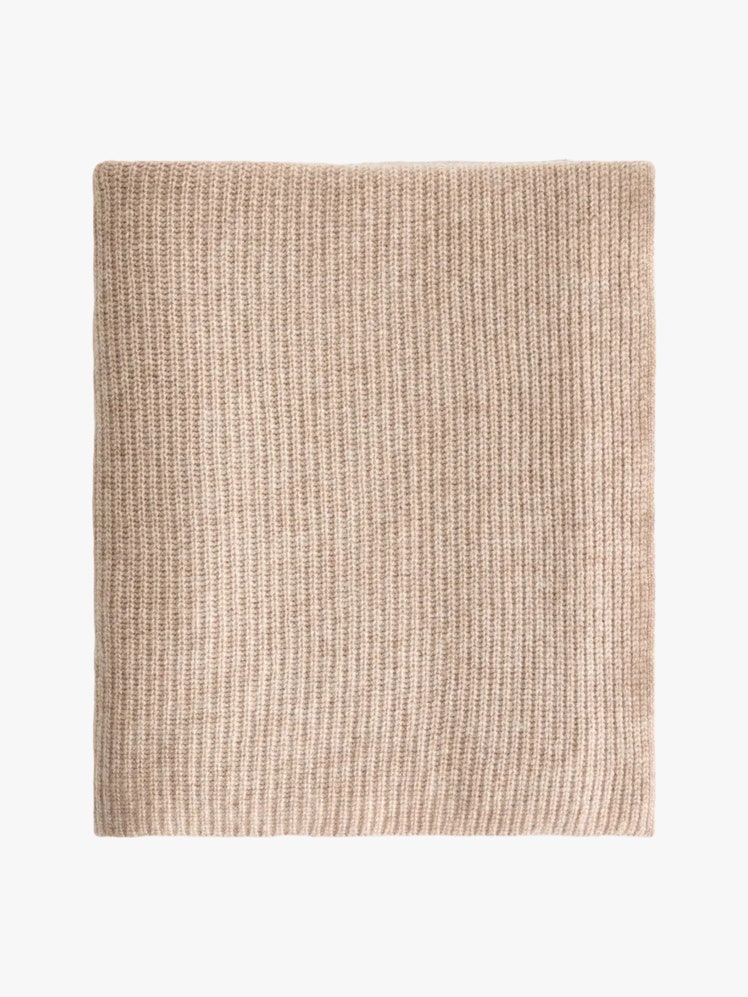 Pink ribbed knit cashmere throw blanket.