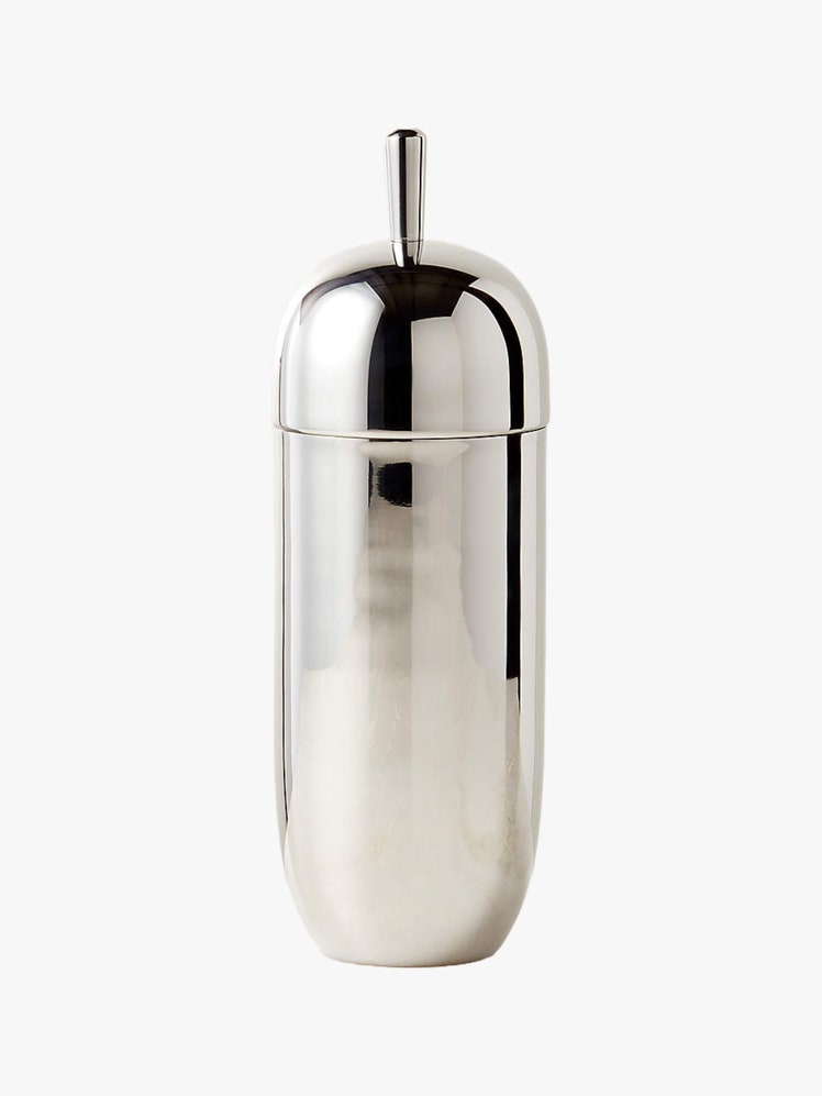 Cylindrical stainless steel cocktail shaker with a rounded lid.