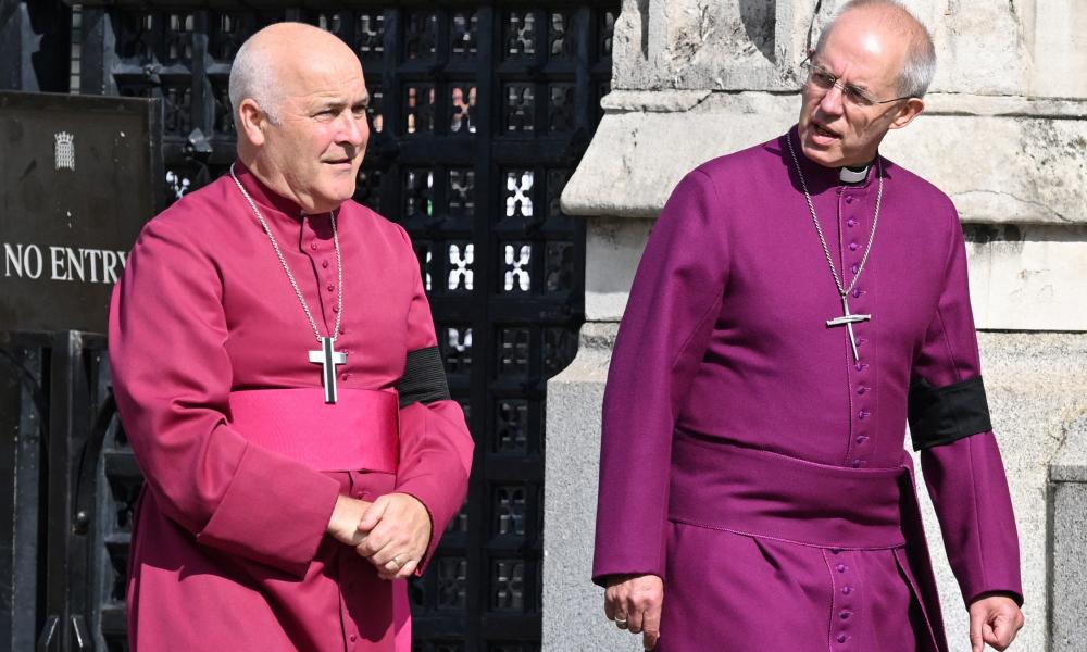 The archbishops of York and Canterbury in their red and purple robes.