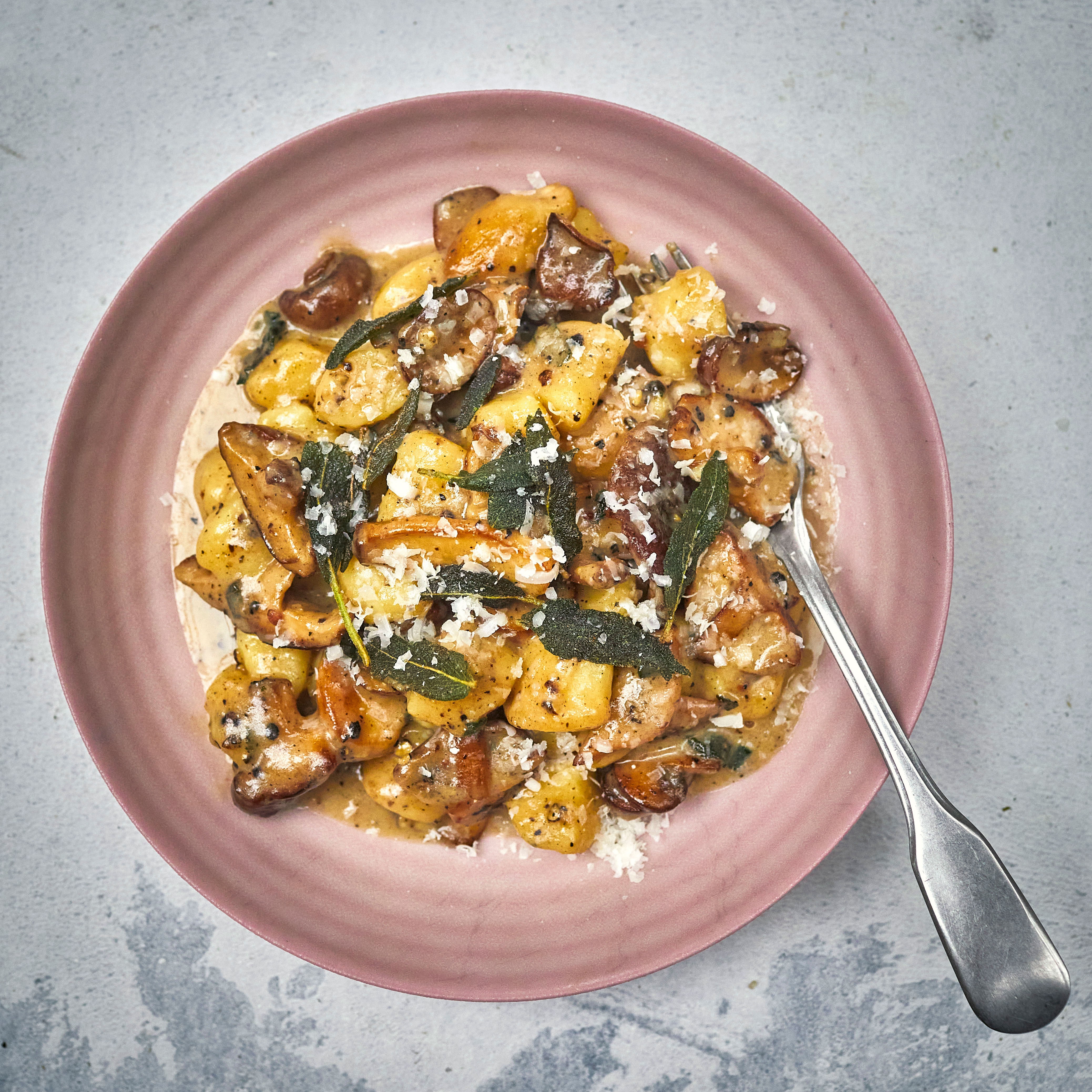 Gnocchi cacio e pepe with mushrooms and sage