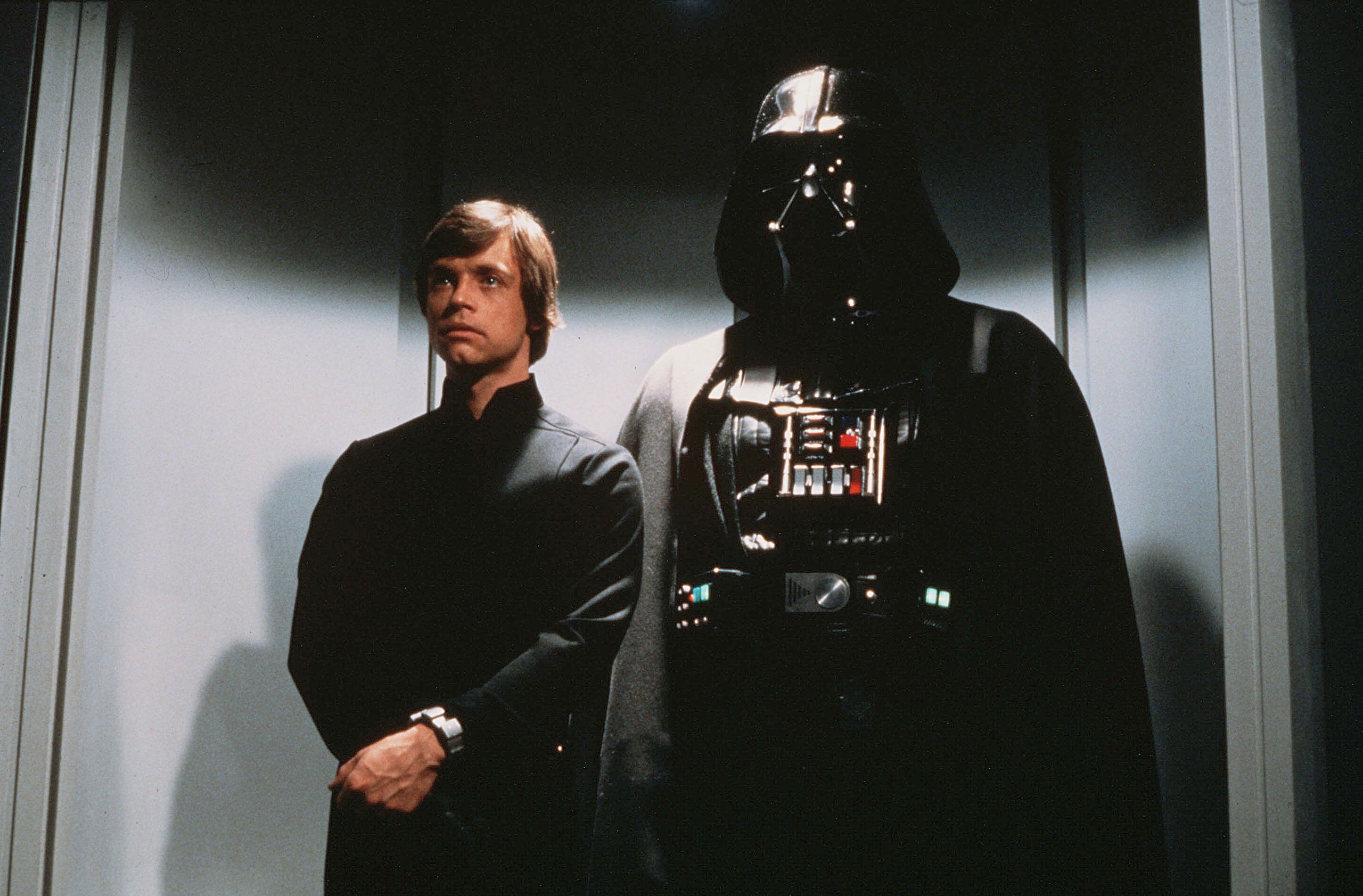 Luke Skywalker standing next to Darth Vader in Return of the Jedi