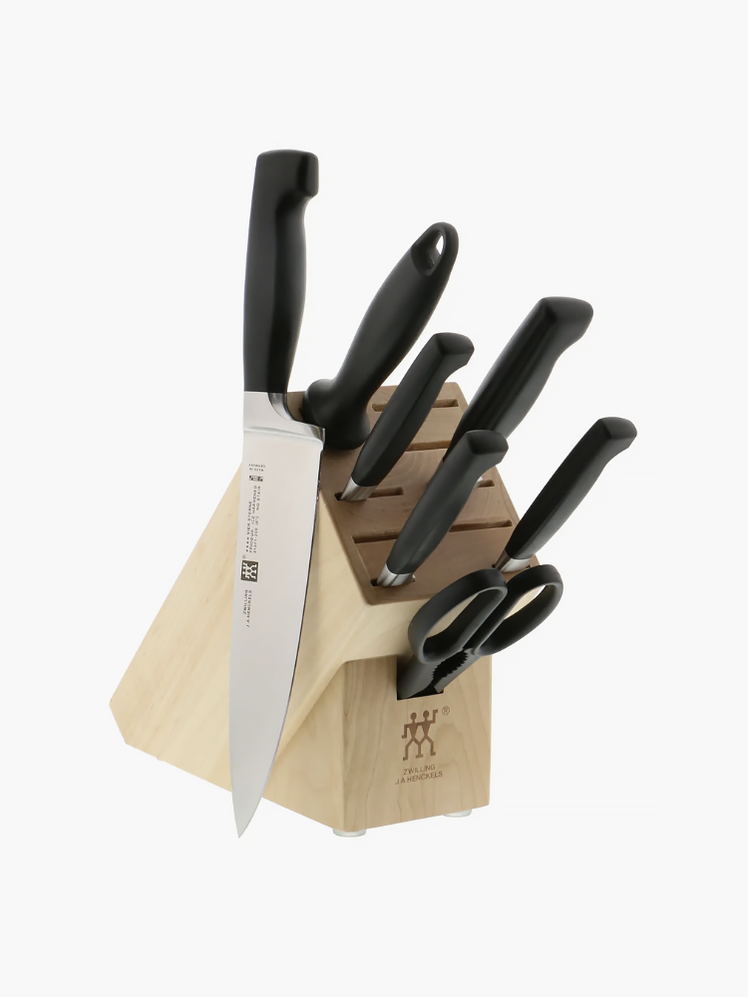 J.A. HENCKELS Four Star Knife Block Set in black and silver on gray background