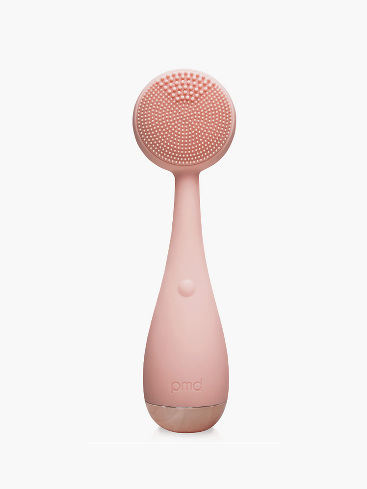 Clean Facial Cleansing Device in light pink on light gray background