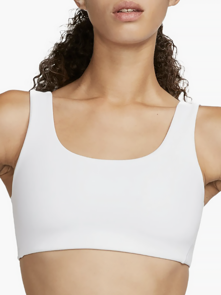 Alate All U Sports Bra in white on model on light gray background