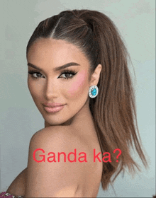 a woman with a ponytail and the word ganda ka written on her back