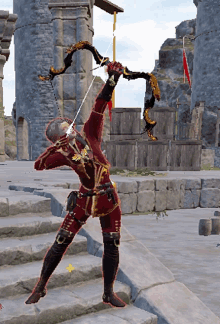 a man in a red costume is holding a bow and arrow