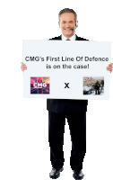 a man holding a sign that says cmg 's first line of defence