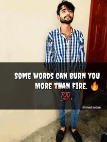 a man in a plaid shirt stands in front of a door with a quote that says some words can burn you more than fire 700