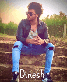 a man wearing sunglasses sits on a set of stairs with the name dinesh written on the bottom