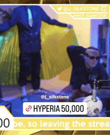 a man in a cape is standing in front of a screen that says hyperia 50,000 on it