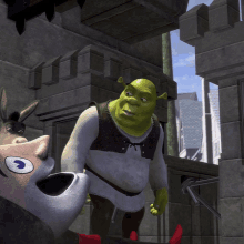 shrek and a donkey standing next to each other in front of a building