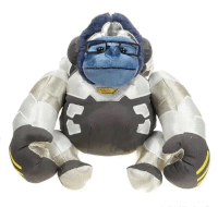 a stuffed gorilla wearing glasses and a helmet is sitting on a white surface