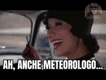 a woman is sitting in a car and smiling with the words ah anche meteorologo