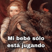 a painting of a little girl holding a monster with the words mi bebé solo está jugando below it .