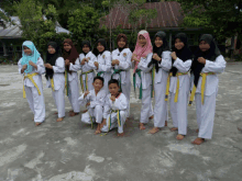 a group of young girls and boys are posing for a picture