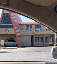 a restaurant with a large w on the side of it