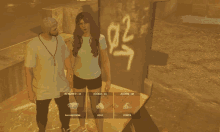 a man and a woman are standing next to each other in front of a wall with graffiti on it that says 92