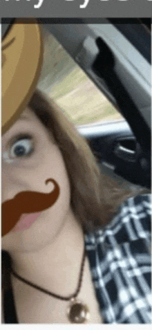 a woman wearing a fake mustache and cowboy hat