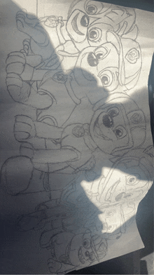 a drawing of a group of paw patrol characters on a piece of paper