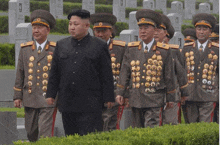 a group of men in military uniforms with medals around their neck