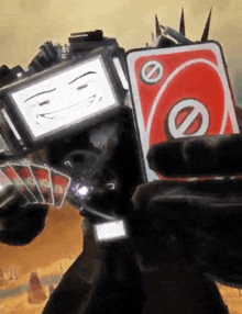 a person is holding a uno card in their hands