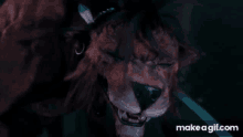 a close up of a lion 's face with make a gif.com written on the bottom