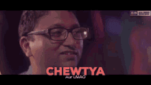 a man wearing glasses is making a funny face and the word chewytya is above him