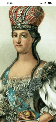 a phone screen shows a portrait of a woman wearing a large crown