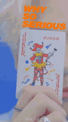 a person holding a joker card with the words " why so serious " written above it