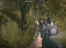 a person holding a sniper rifle in a video game with the name haid beiramar