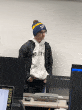 a man wearing a beanie and a hollister sweatshirt