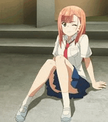 a girl in a school uniform and tie is sitting on the ground with her legs crossed .