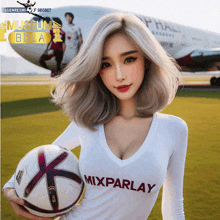 a woman wearing a mixparlay shirt holds a soccer ball in front of an airplane