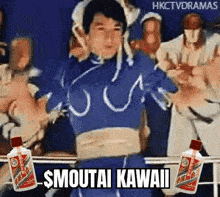 a man dressed as chun li from street fighter is dancing in front of a crowd while holding two bottles of alcohol .