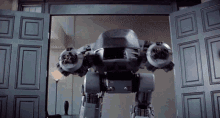 a robot is standing in the doorway of a building