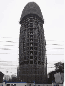 a very tall building under construction with the number 12 on the top